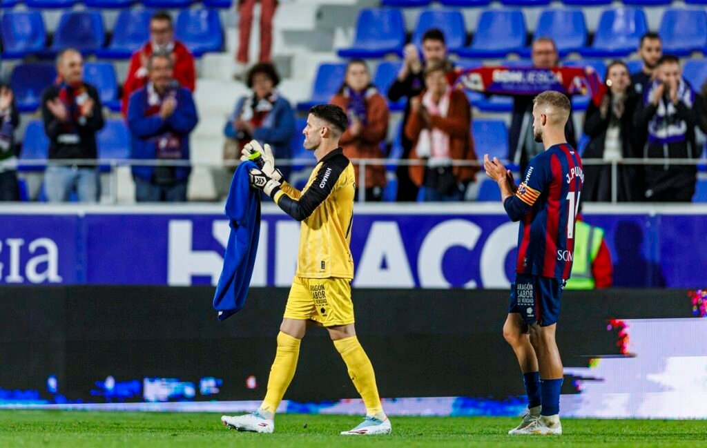 Dani Jiménez y Jorge Pulido a la finalización de un encuentro del Huesca