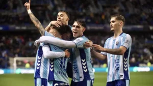 Los jugadores del Málaga CF celebran un gol marcado ante el Burgos CF